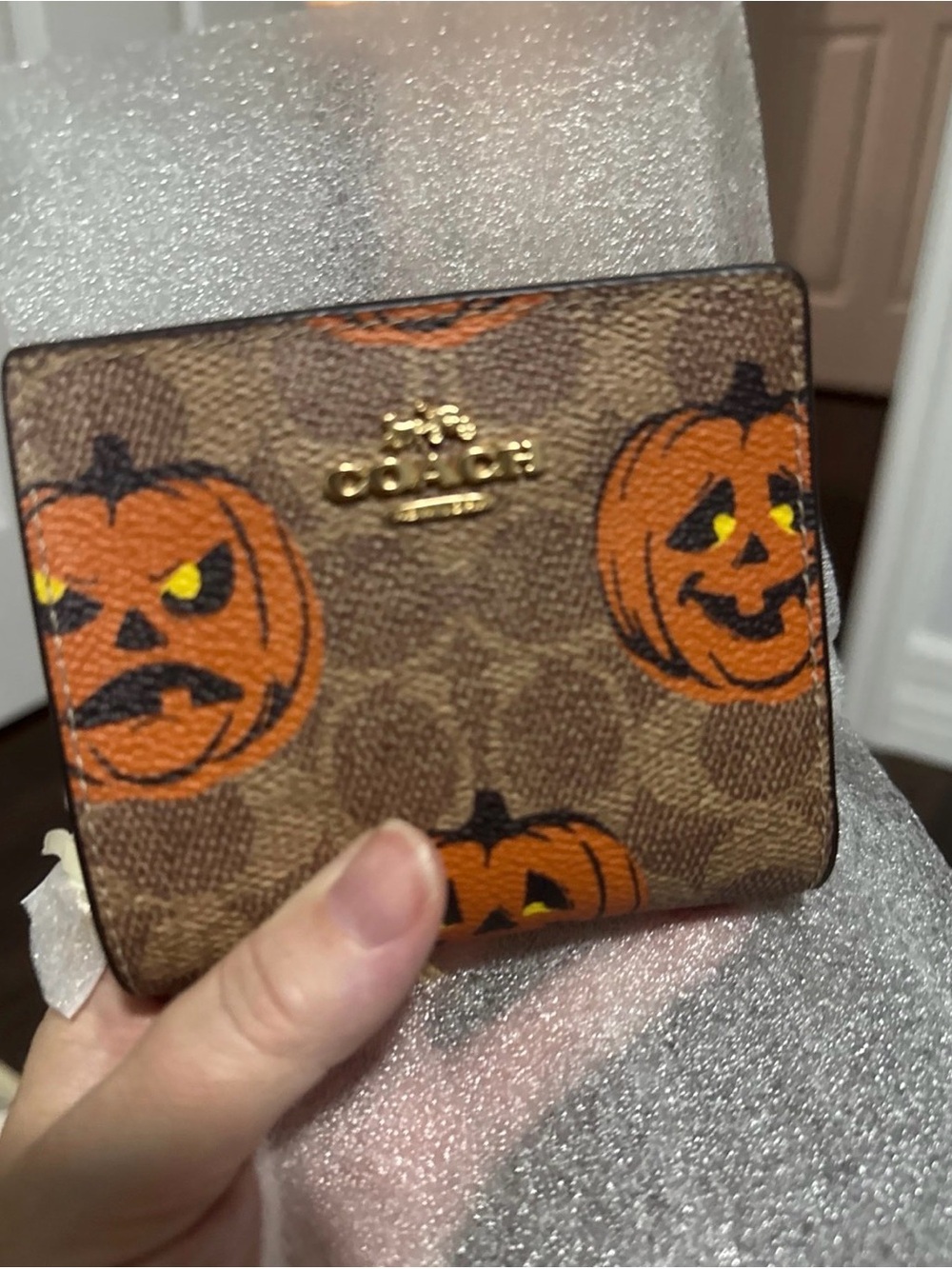 Coach 2025 Halloween Wallet with Orange Pumpkin Print and Gold Logo